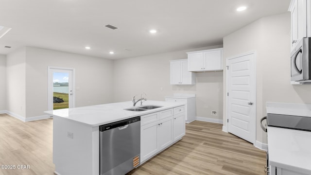 3326 Rachel Pl, Panama City, FL 32409 - kitchen with light wood-type flooring, a sink, white cabinets, and stainless steel appliances