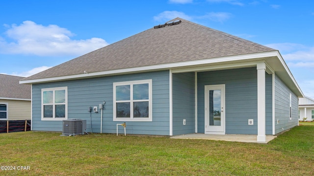 3326 Rachel Pl, Panama City, FL 32409 - back of property with a lawn, central AC unit, a patio area, and roof with shingles