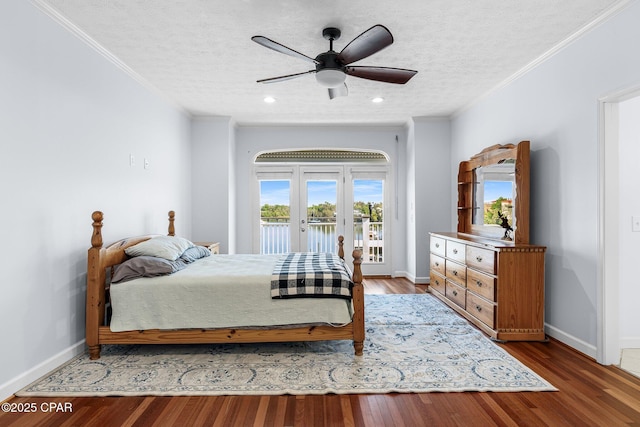 bedroom featuring crown molding, baseboards, and access to exterior