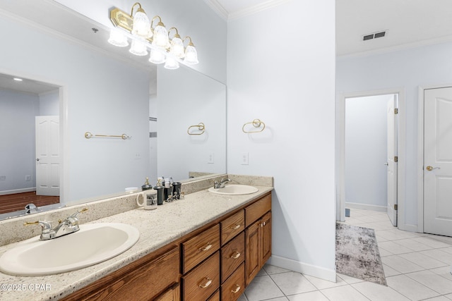 full bath featuring crown molding, visible vents, and a sink