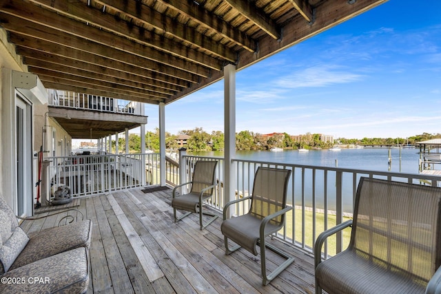 wooden deck featuring a water view