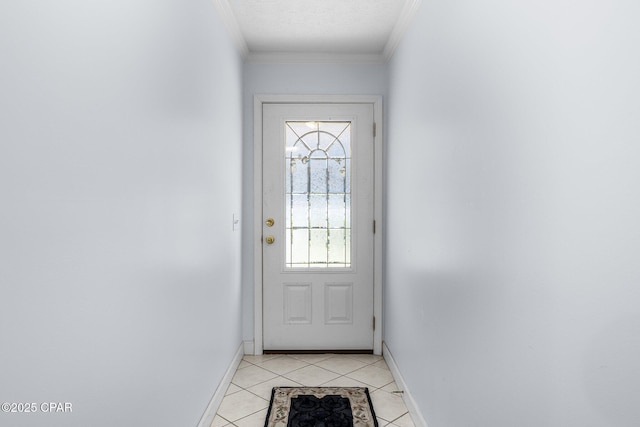 doorway to outside with crown molding, baseboards, and light tile patterned floors