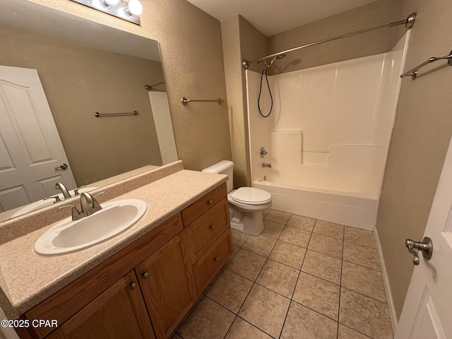 bathroom with tile patterned floors, toilet, vanity, and bathing tub / shower combination