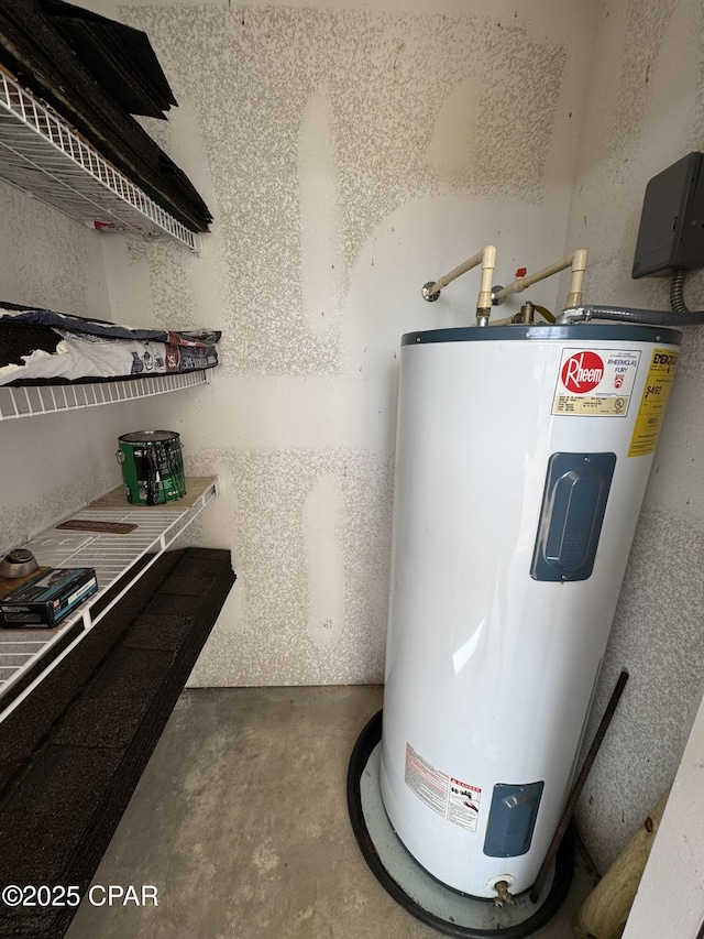 utility room featuring water heater