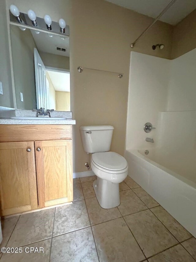 full bath with tub / shower combination, visible vents, toilet, and tile patterned floors