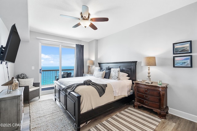 14825 Front Beach Rd Unit 2209, Panama City Beach, FL 32413 - bedroom with access to outside, wood finished floors, baseboards, a ceiling fan, and a water view