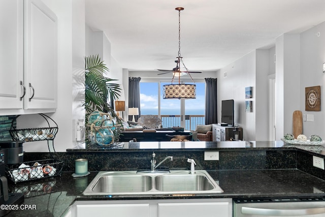 14825 Front Beach Rd Unit 2209, Panama City Beach, FL 32413 - kitchen with dishwasher, a sink, white cabinets, and open floor plan