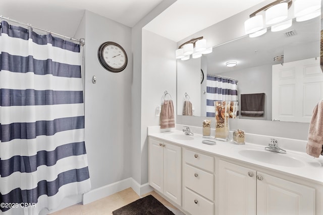 14825 Front Beach Rd Unit 2209, Panama City Beach, FL 32413 - full bathroom with double vanity, tile patterned floors, baseboards, and a shower with curtain