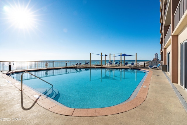 14825 Front Beach Rd Unit 2209, Panama City Beach, FL 32413 - community pool featuring a water view and a patio area