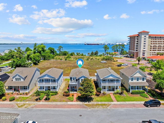 birds eye view of property featuring a water view
