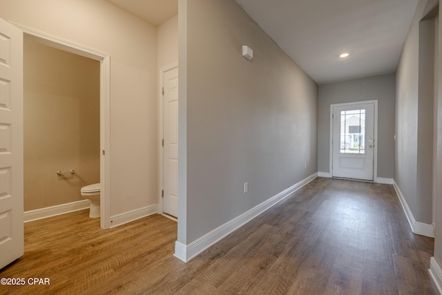 doorway to outside with baseboards, recessed lighting, and wood finished floors