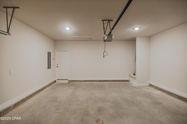 garage with baseboards, recessed lighting, and a garage door opener