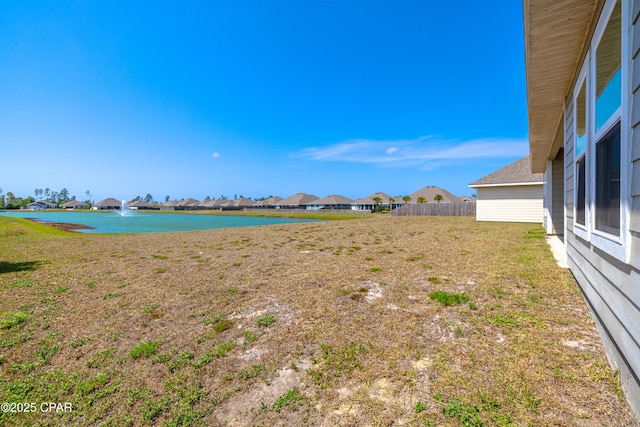 water view with a residential view and fence