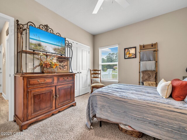 133 Stonegate Dr, Santa Rosa Beach, FL 32459 - bedroom with a ceiling fan, a closet, and light colored carpet