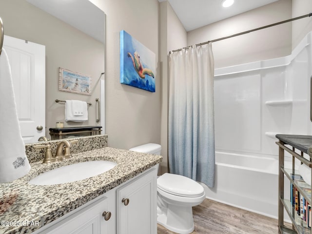 133 Stonegate Dr, Santa Rosa Beach, FL 32459 - bathroom with vanity, wood finished floors, shower / bathtub combination with curtain, and toilet