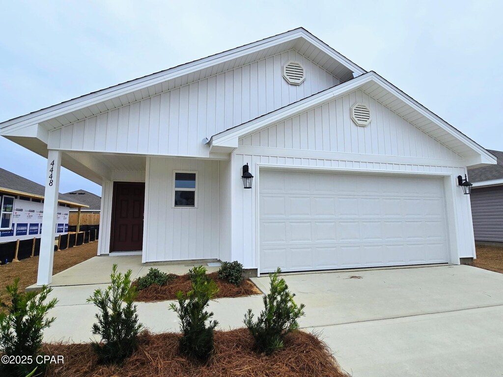 5072 Windrow Way, Panama City, FL 32404 - view of front facade with an attached garage and driveway