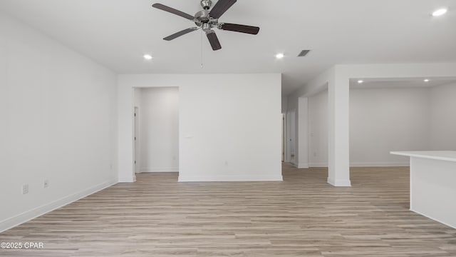 unfurnished living room featuring ceiling fan, light wood-style flooring, baseboards, visible vents, and recessed lighting