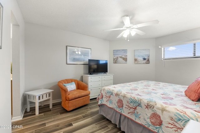 17155 Front Beach Rd Unit E602, Panama City Beach, FL 32413 - bedroom with wood finished floors, ceiling fan, and baseboards