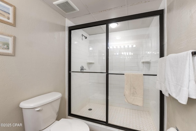 17155 Front Beach Rd Unit E602, Panama City Beach, FL 32413 - full bathroom featuring toilet, a stall shower, and a textured wall