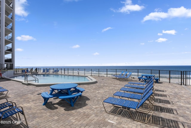 17155 Front Beach Rd Unit E602, Panama City Beach, FL 32413 - community pool with a water view and a patio