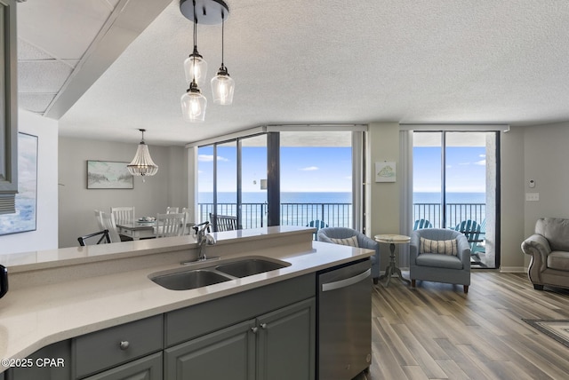 17155 Front Beach Rd Unit E602, Panama City Beach, FL 32413 - kitchen featuring dishwasher, a sink, a water view, gray cabinetry, and open floor plan