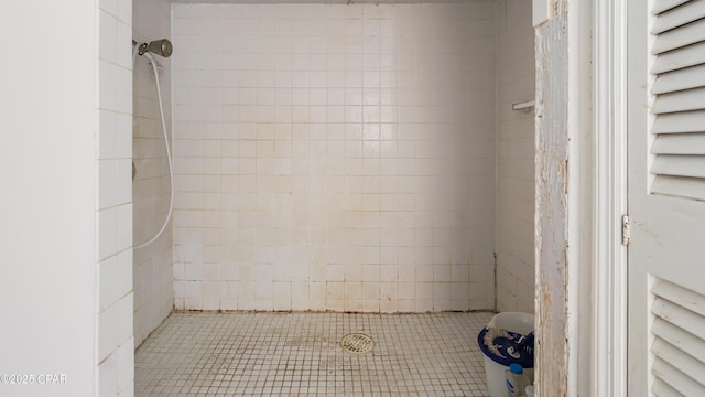 bathroom with tiled shower