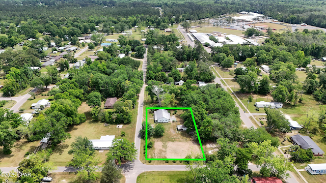 aerial view featuring a wooded view