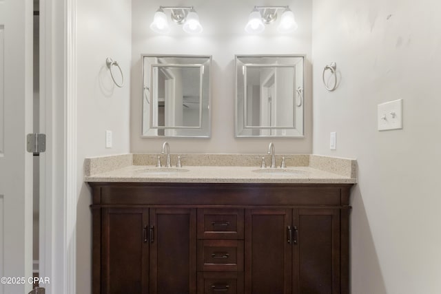 bathroom featuring double vanity and a sink