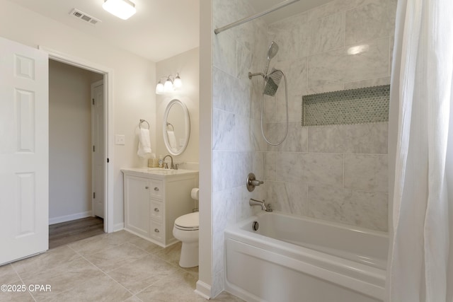 full bath featuring shower / bath combo, vanity, tile patterned floors, toilet, and visible vents