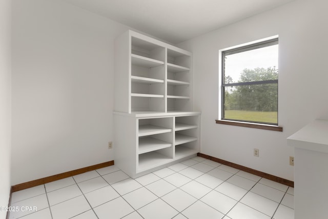 spare room with baseboards