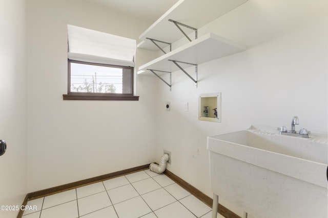 laundry area featuring hookup for an electric dryer, a sink, washer hookup, laundry area, and baseboards