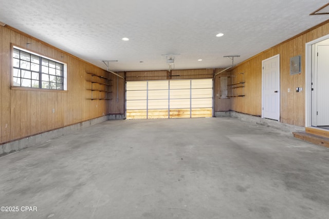 garage with wooden walls and recessed lighting