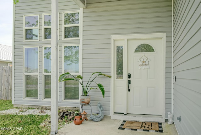 doorway to property with fence