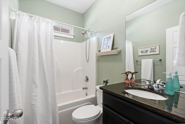 bathroom featuring vanity, shower / bath combo with shower curtain, and toilet