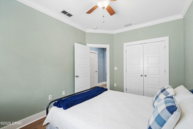 bedroom featuring crown molding, baseboards, and visible vents