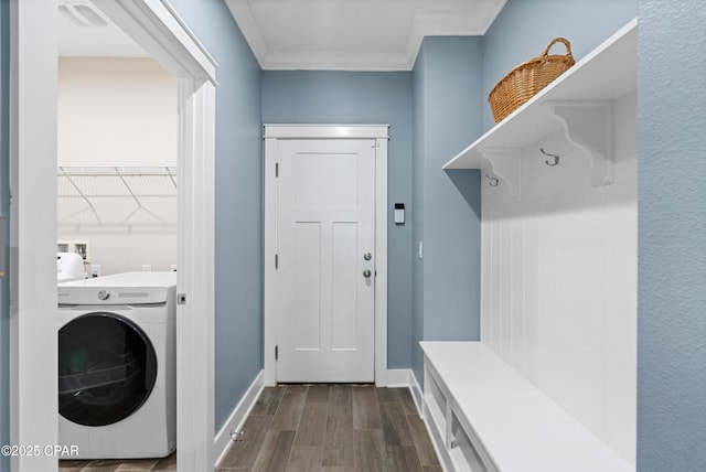 washroom featuring laundry area, ornamental molding, baseboards, washer / clothes dryer, and dark wood-style floors