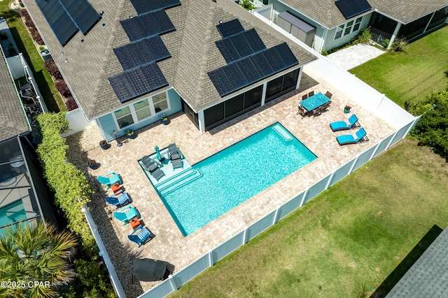 pool with a patio, a fenced backyard, and a lawn