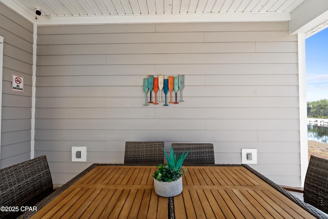 exterior space with a healthy amount of sunlight, a sauna, and wooden walls