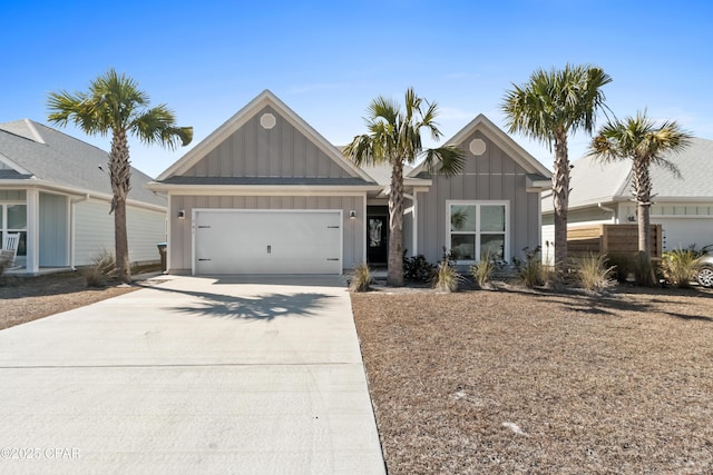 view of front of property with an attached garage, board and batten siding, and driveway