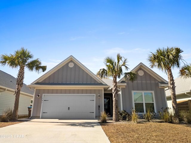 ranch-style home featuring board and batten siding, an attached garage, and driveway