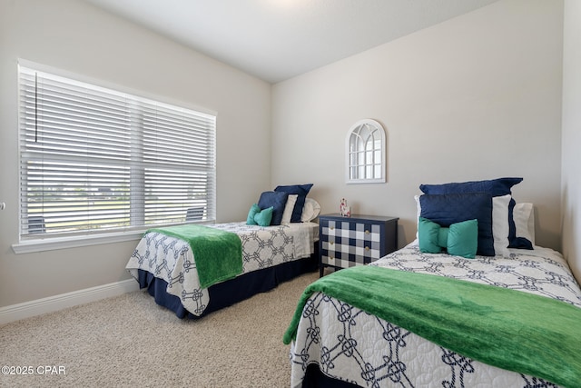 carpeted bedroom with baseboards