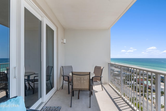 balcony with a view of the beach and a water view