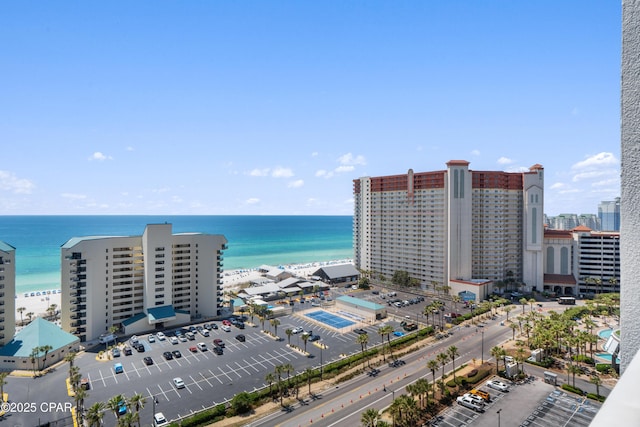 birds eye view of property featuring a water view and a view of city
