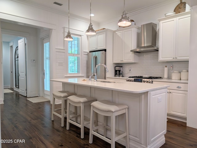 44 E Royal Fern Way, Santa Rosa Beach, FL 32459 - kitchen featuring wall chimney exhaust hood, high quality fridge, decorative backsplash, light countertops, and dark wood-type flooring