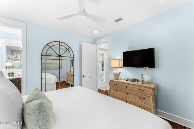 bedroom with baseboards, a ceiling fan, visible vents, and dark wood-type flooring