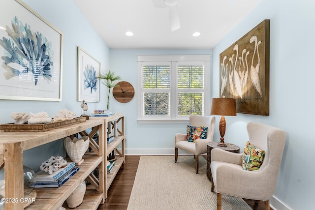 living area featuring recessed lighting, dark wood finished floors, and baseboards