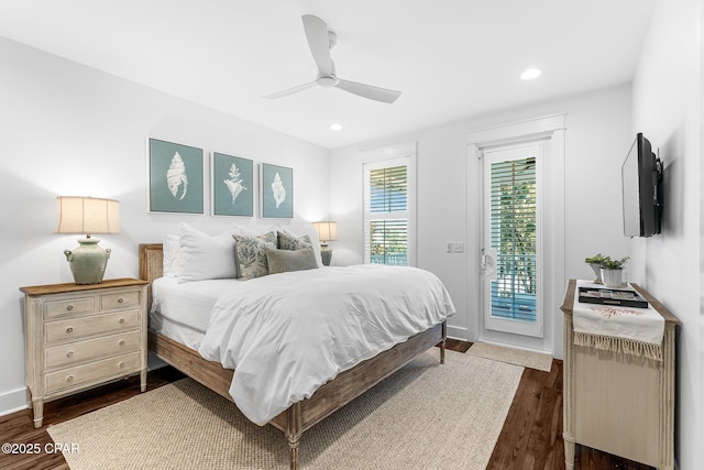bedroom featuring dark wood-type flooring, access to outside, and recessed lighting