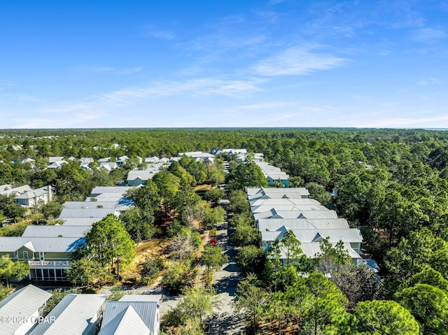 aerial view featuring a residential view and a wooded view
