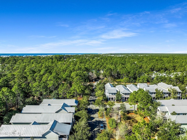 drone / aerial view with a view of trees and a residential view