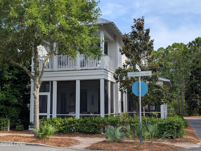 44 E Royal Fern Way, Santa Rosa Beach, FL 32459 - view of home's exterior with a sunroom and a balcony